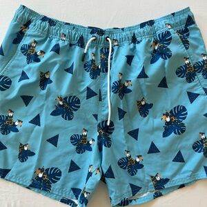 Oakley Blue Swim Trunks with Tropical Leaf Design